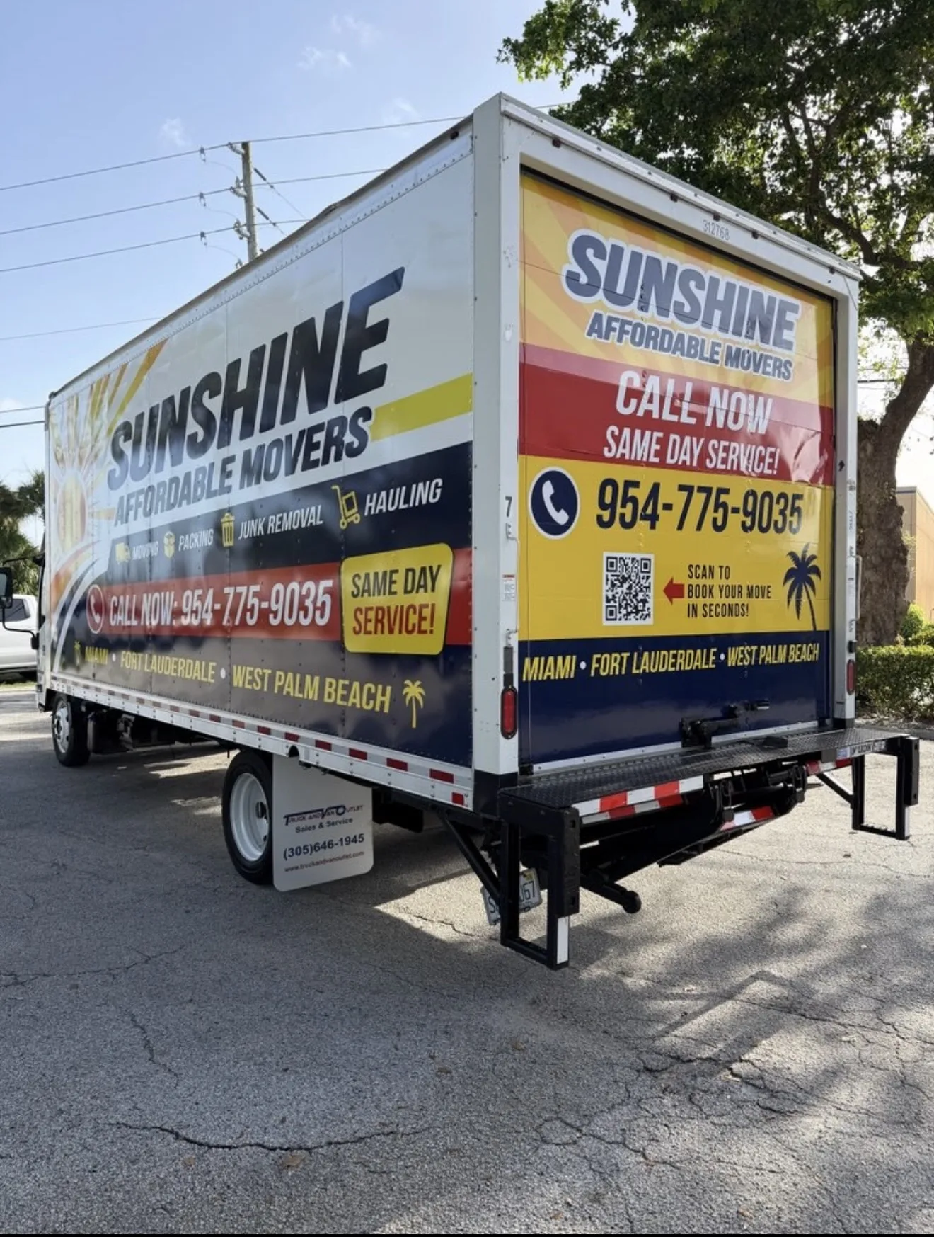 Rear side view of a Sunshine Affordable Movers truck ready for loading.