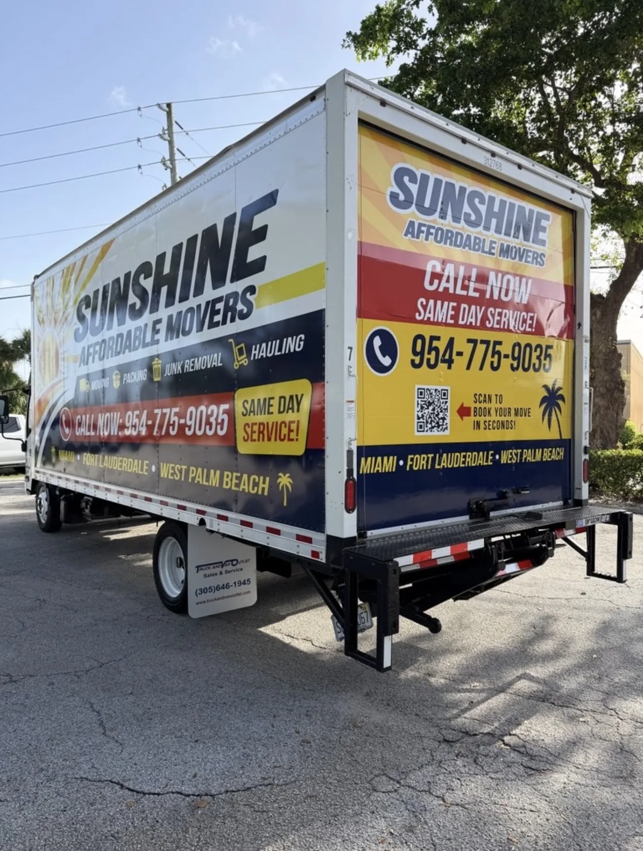 Rear three-quarter view of a Sunshine Affordable Movers box truck.
